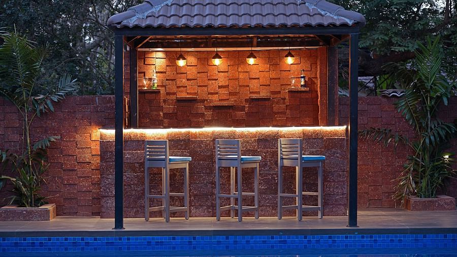 Multi-cuisine restro bar facing swimming pool with clean and crystal clear water at Grand Continent, Anjuna - A Sarovar Portico Affiliate Hotel  